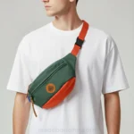 sac-banane-homme-tendance-vert-orange-homme-bandouliere sac banane homme tendance vert et orange porté en bandoulière par un homme