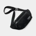 sac banane homme velours côtelé noir posé à plat