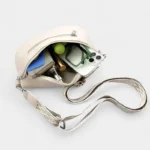 sac banane sangle interchangeable beige rempli d'affaires