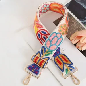 Bandoulière Brodée Bohème Motifs Floraux avec mousquetons dorés, tissu en nylon à motifs colorés sur fond blanc.