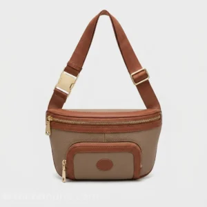 Sac banane femme en cuir grainé taupe et acajou avec double poche zippée et sangle réglable, vue de face sur fond gris clair