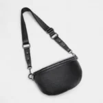 Sac Banane Femme Moderne Cuir noir avec bandoulière réglable et fermeture éclair Sac Banane Femme Moderne Cuir noir avec une bandoulière réglable et une fermeture éclair