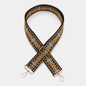 Bandoulière Motifs Jacquard Nordique jaune avec mousquetons en métal doré et boucle de réglage apparente.