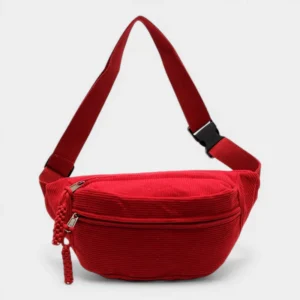 Banane en velours côtelé rouge posée de face avec sangle tressée et zip à cordon assorti