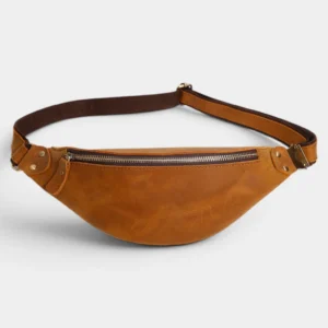 Petit sac banane cuir marron clair posé de face, avec fermeture métallique et sangle contrastante