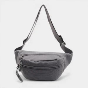 Sac banane velours côtelé gris ardoise posé de face, avec sangle tressée et zip assorti