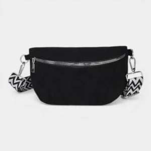 Sac banane velours côtelé noir posé de face avec sangle à motif chevron et fermeture argentée