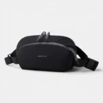 Sac Banane Nylon Imperméable Gorpcore Sac banane nylon noir au style gorpcore, posé de face avec des zips gris anthracite