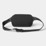 Sac banane nylon noir, vue arrière posé à plat, avec sangle à motif quadrillé et clip plastique