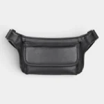 Sac banane cuir motard poche rabat noir posé à plat, vue de face avec sangle repliée au sommet