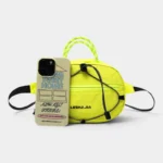 Sac Banane Technique Gorpcore Outdoor Nylon Ripstop Sac banane nylon jaune fluo au style gorpcore, posé de face avec une corde tressée en guise de poignée