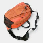 Sac banane randonnée en nylon ripstop orange vu de dessus, avec sangle réglable noire