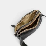 Sac banane en simili cuir grainé noir vu de dessus, ouvert avec doublure dorée contrastante et double compartiment zippé
