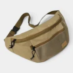 Grand Sac Banane XXL Streetwear Grand sac banane XXL streetwear en nylon beige kaki, posé de face avec une sangle à clip plastique noir
